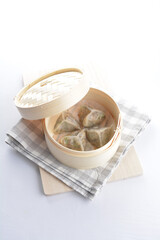 steamed handmade crystal vegetable prawn shrimp dumpling har gao in bamboo basket on white background vegan appetiser dim sum snack Halal food restaurant cuisine menu for cafe