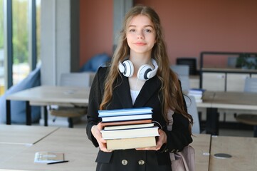education and school concept - student girl studying and reading book at school.