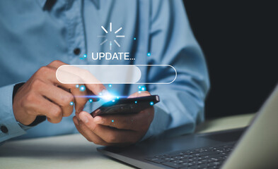 Man using smartphone upgrade program, Update software system in computer.Business technology...
