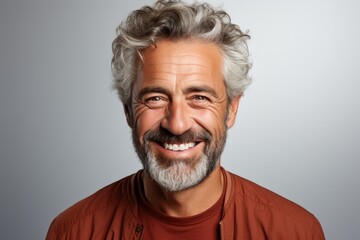 Obraz premium Handsome middle age man with beard wearing casual clothes over light background. Happy face smiling, looking at the camera. Positive person.