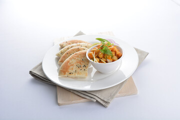 Indian vegetable bean curry sauce with baked naan pizza toast bread kebab breakfast on white background asian chef appetiser halal bakery food restaurant pastry menu for cafe
