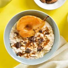 Oat porridge with caramelized pear and chocolate pieces