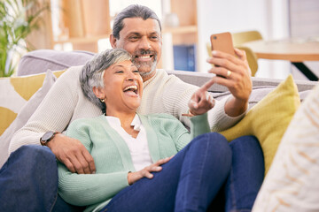 Mature couple, laugh and phone in home of social media post, meme or mobile app subscription. Happy man, woman and reading funny joke on internet, scroll on smartphone or relax on sofa in living room