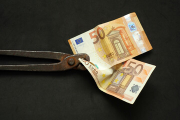 In europe inflation takes people's money and makes people poor. Money and pincers, pincers that attract money,