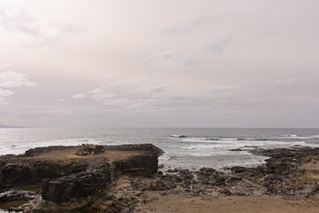 Lonely abandoned old house on the coast against sea in El Confital, Las Palmas de Gran Canaria, Spain