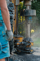 Close up of well drilling rig boring dowin into the earth.