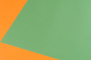 Obraz premium Two colors background, green and orange colors, flat lay, top view