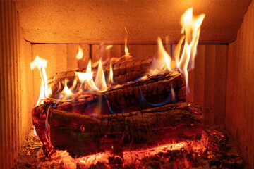 Fireplace close up, fire flame and burning wood log, warm home in winter