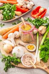 Homemade vegetable broth powder, organic vegetable stock, with raw vegetables, mushrooms and herbs