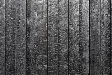 Fotobehang Burnt wooden board texture. Sho Sugi Ban Yakisugi is a traditional Japanese method of wood preservation © Tomas Ragina