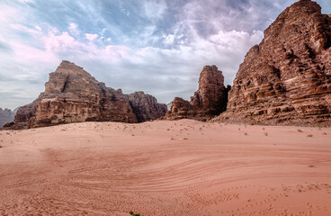 Scenic landscape in Wadi Rum (aka Valley of the Moon), a valley cut into the sandstone and granite...