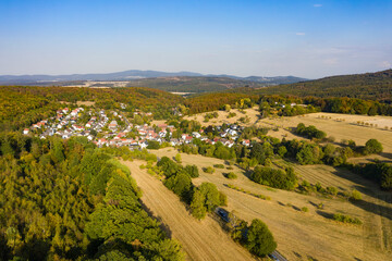 Bird's-eye view of a small village in Taunus - Germany in the warm morning light