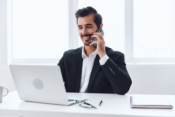 Phone man laptop computer talk businessman office