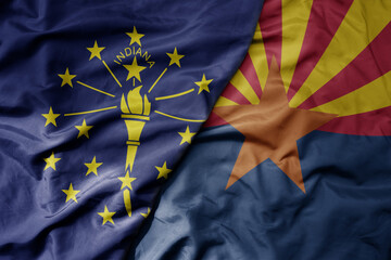 big waving colorful national flag of arizona state and flag of indiana state .
