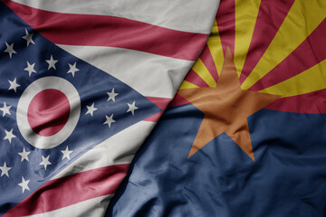 big waving colorful national flag of arizona state and flag of ohio state .