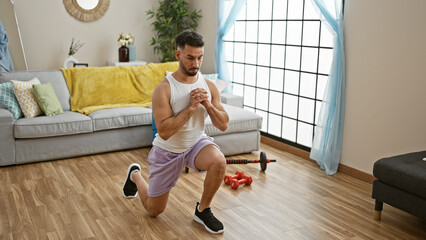 Young arab man training legs exercise at home