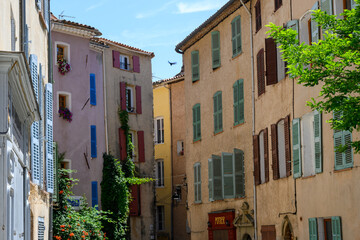 Travel destination, small ancient village Cotignac in Var, Provence, surrounded by vineyards and cliffs with troglodytes houses.