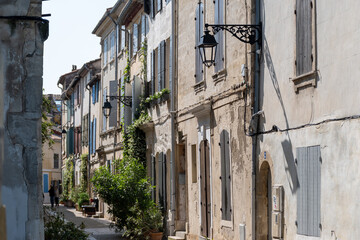 View on old streets and houses in ancient french town Arles, touristic destination with Roman ruines, Bouches-du-Rhone, France