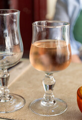 French cold rose dry wine from Provence in glass served for lunch in restaurant, Aigues-Mortes, Gard, France