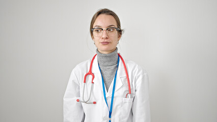 Fototapeta premium Young caucasian woman doctor standing with serious expression over isolated white background