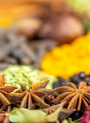 Various spices, peppers and herbs close-up top view. Eastern spice market. A set of peppers and spices for cooking.