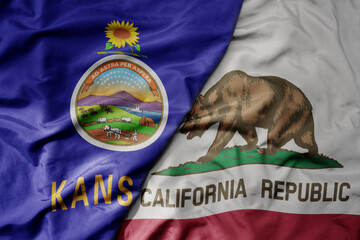 big waving colorful national flag of california state and flag of kansas state .