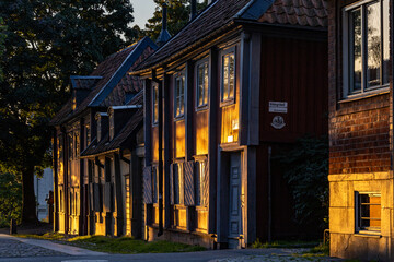Stockholm, Sweden Old wooden houses in the orange  dawn light on the island of Sodermalm on  Master Mikaels gatan,