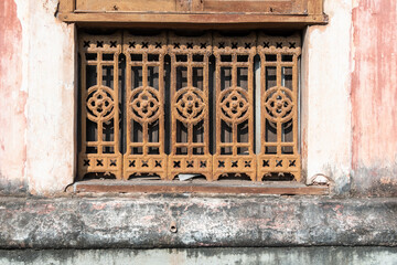 An old window with rusty iron grilles of an old Portuguese era house in Margao in South Goa.
