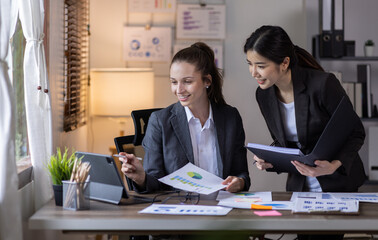 Teamwork asian business woman and Profession businesswomen, accounting concept, doing planning analyzing the financial report, business plan investment, finance analysis financial in office