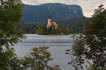 Scenic landscape view of Bled Lake with island and mountains in background. The most famous lake in...
