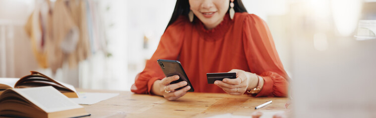 Woman hands, credit card and phone for business online shopping, trading or fintech payment in...