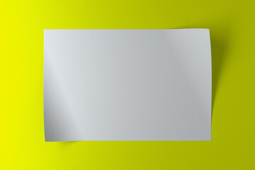 A piece of white paper with curved edges on green background