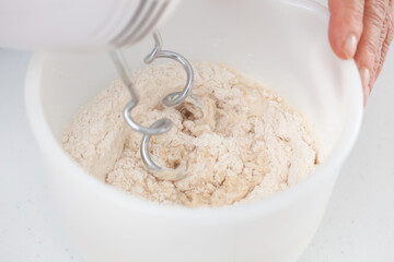 Beating the dough. Home made pizza dough preparation. Pizza preparation.