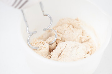 Beating the dough. Home made pizza dough preparation. Pizza preparation.