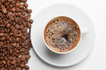 cup of coffee with beans