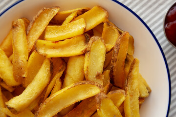 Homemade French Fries with Ketchup on a Plate, top view. Flat lay, overhead, from above.