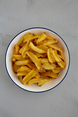 Homemade French Fries on a Plate, top view. Flat lay, overhead, from above. Close-up.