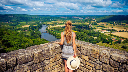 Woman traveling in France-Dordogne river viewpoint of Domme