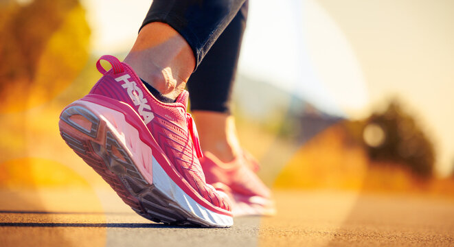 July 2023, Hoka running shoe, sunlight on asphalt road