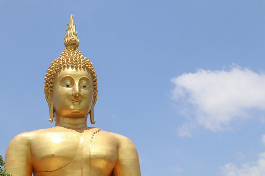 Biggest golden Buddha statue in the world against blue sky and white clouds background,Wat Muang  Ang Thong Province, Thailand