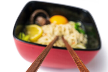 oriental noodle soup in a traditional bowl