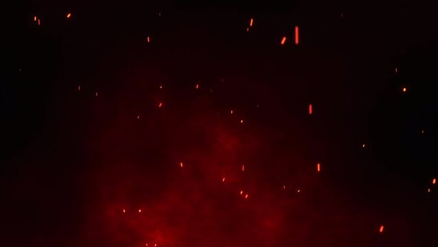Fire flakes moving on the maroon sky with the feeling of a huge fire happening. Bright fire particles rising up with the wind. Bonfire background animation. Flowing fire ashes in the night. 4k. 