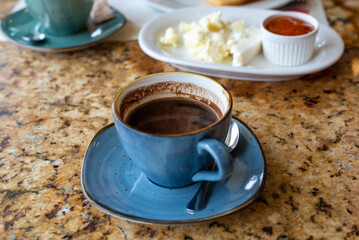 Porcelain cup of coffee on a table