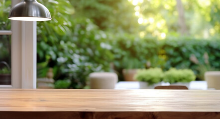 Empty wooden table is complemented by a lamp with blurred garden background. High quality photo