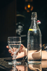 Drink water bottle with glass on table in the restaurant.