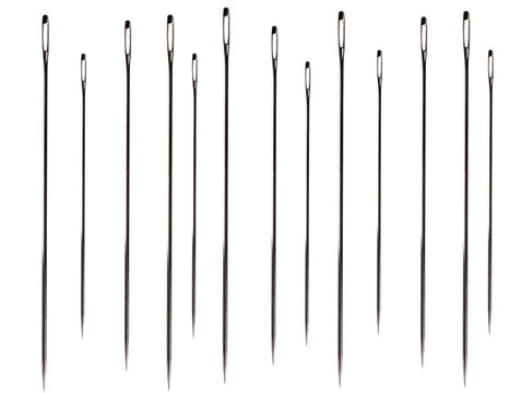 a lot of sewing needles on a white background