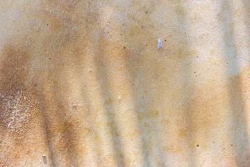 rusty abstract background. brown background. fine texture. paraffin texture. shadow on brown background. rust. rust streaks