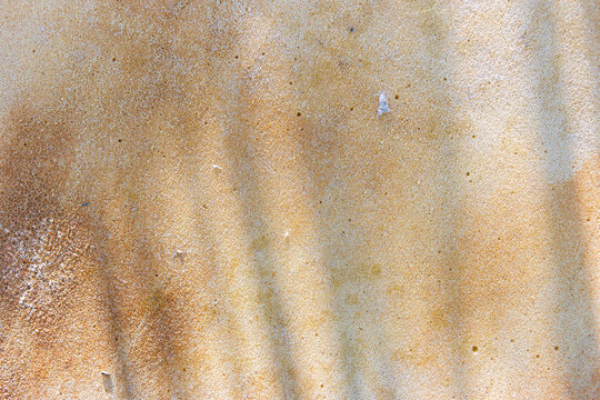 rusty abstract background. brown background. fine texture. paraffin texture. shadow on brown background. rust. rust streaks