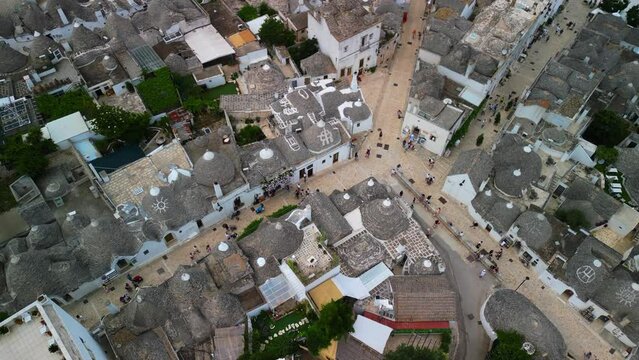 Aerial view of the famous village in Italy Alberobello: conical roofs, trulli houses, amazing architecture