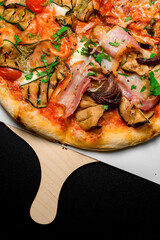 Mix of pizza slices with different flavors in one circle served on wooden board